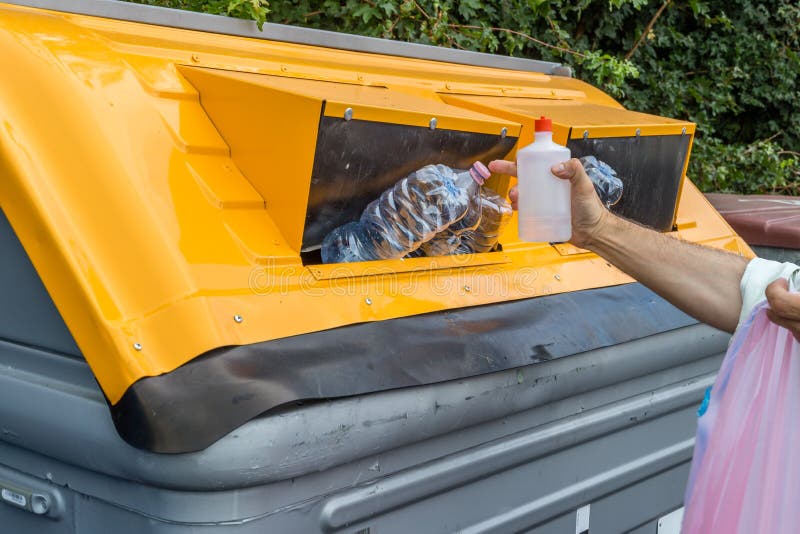 Man Putting Plastic Waste in Recycling Bin Stock Image Image of