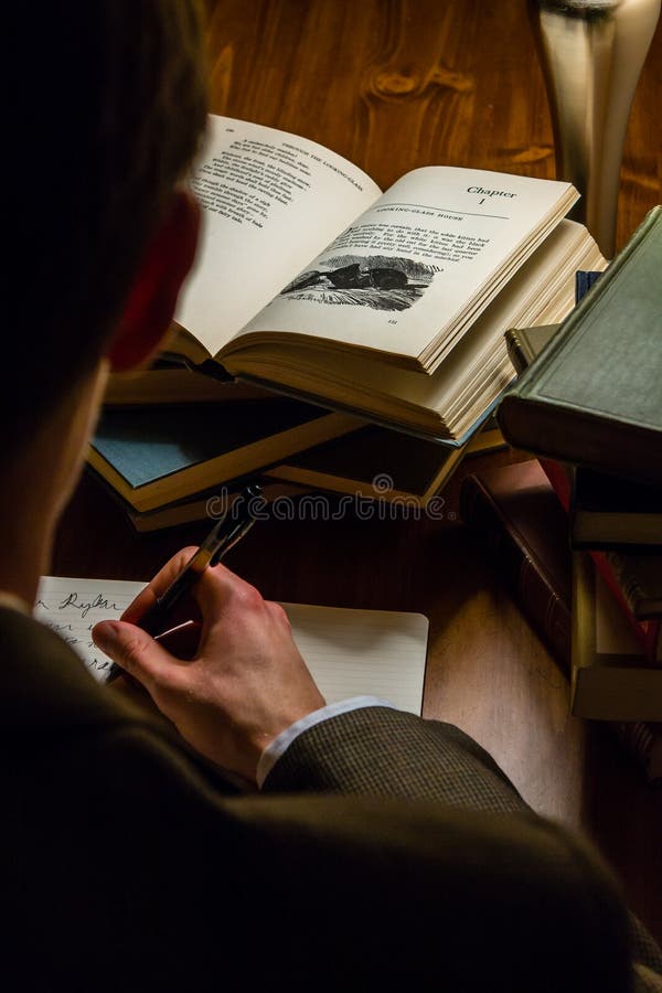Man reading a book and taking notes royalty free stock photography Man reading a book and taking notes royalty free stock photography