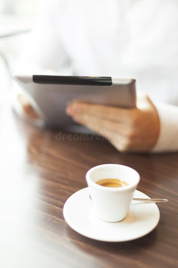 Man reading news at motning on tablet computer