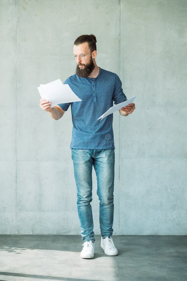 Man reading script papers focused screen writer royalty free stock images Man reading script papers focused screen writer royalty free stock images