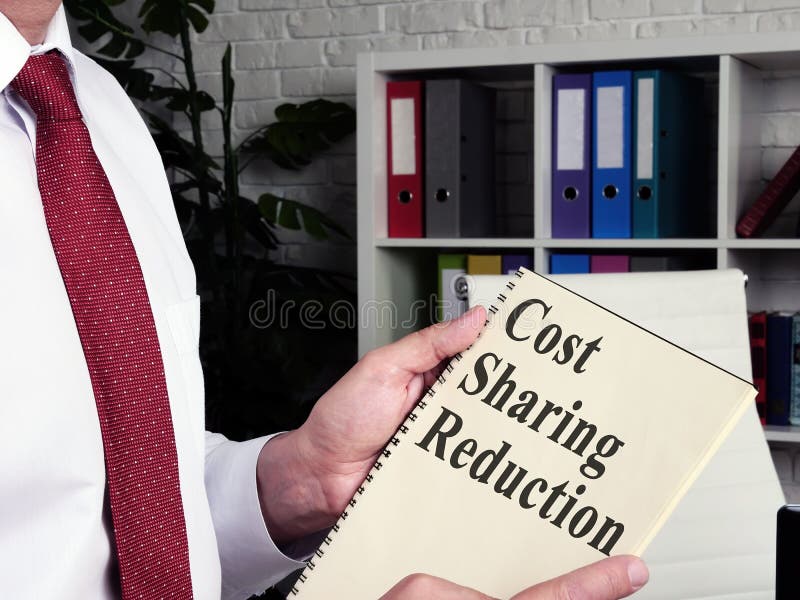 Man Reads About Cost Sharing Reduction Csr In The Book Stock Image Man Reads About Cost Sharing Reduction Csr In The Book Stock Image