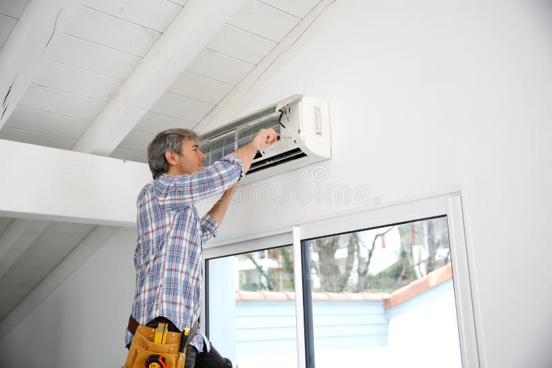 Man Reapiring Air Conditioner Stock Photo Image of install, craftsman