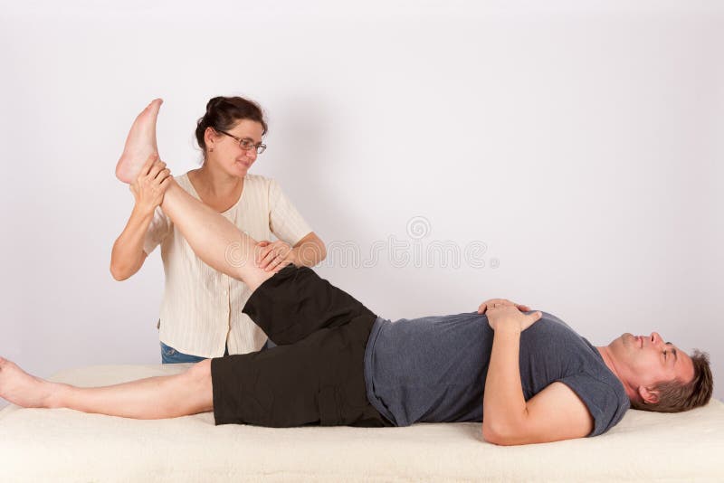 Man receives bowen massage treatment for his legs.