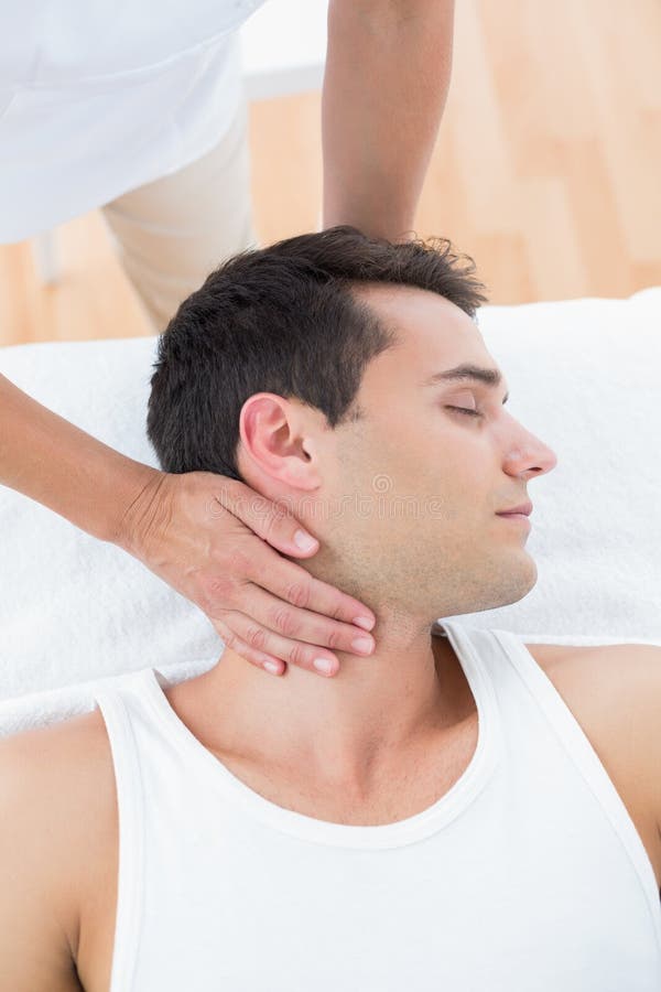 Man receiving neck massage stock photo. Image of room 51614656
