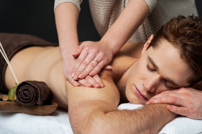 Man receiving relax treatment at spa royalty free stock image