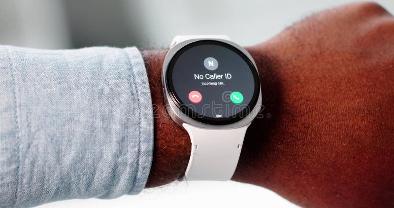Man Rejects IRS Scam Call On Smartwatch, Health Tracker stock photo