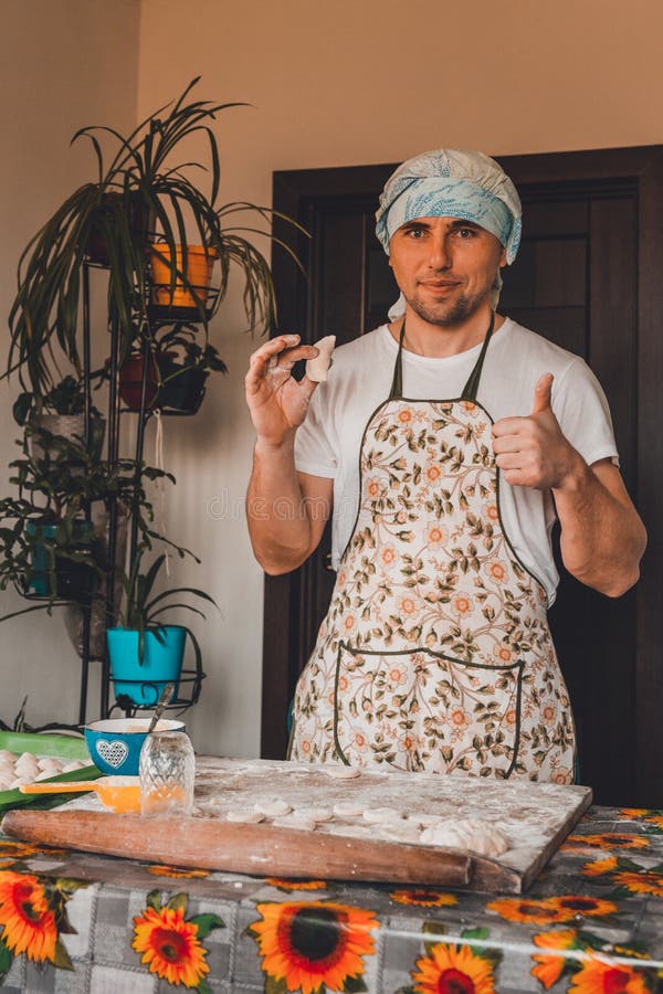 The man rejoices. for the first time properly cooked raw dumpling stock images