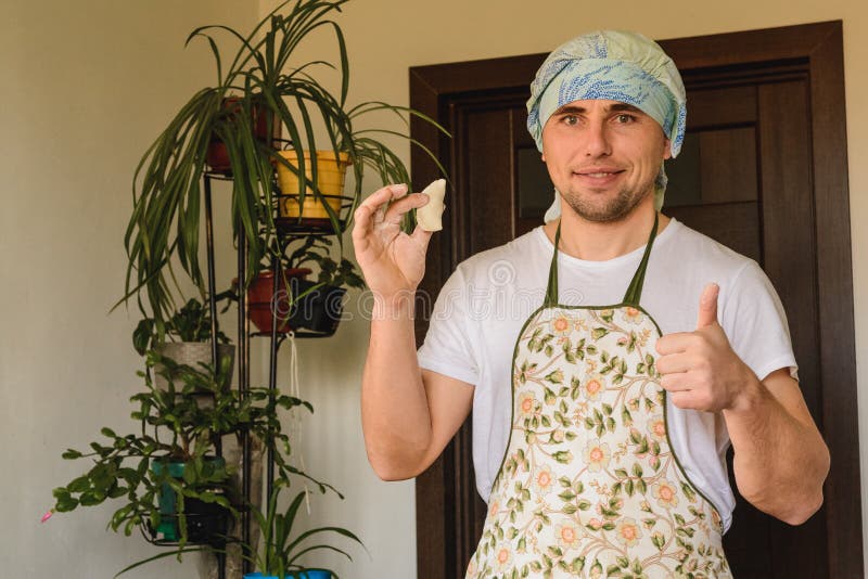 The man rejoices. for the first time properly cooked raw dumpling royalty free stock photos