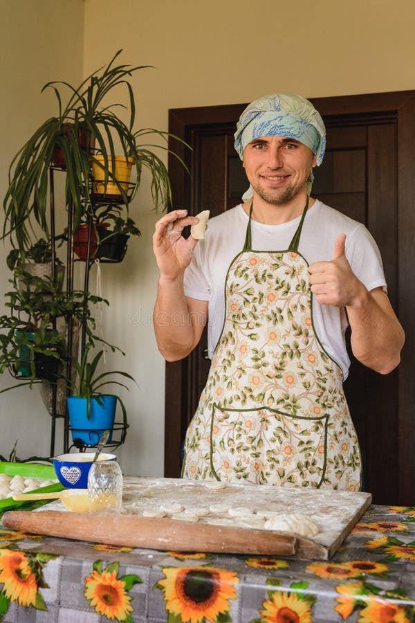 The man rejoices. for the first time properly cooked raw dumpling royalty free stock photos