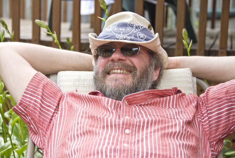 Man Relaxing in a Chair royalty free stock photos