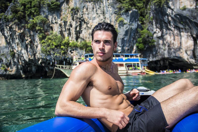 Man relaxing on a raft with action camera stock photos Man relaxing on a raft with action camera stock photos