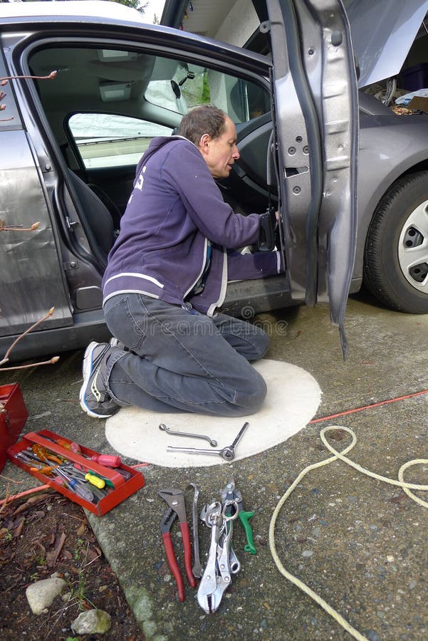 138 Man Repairing Broken Car Door Stock Photos Free & RoyaltyFree