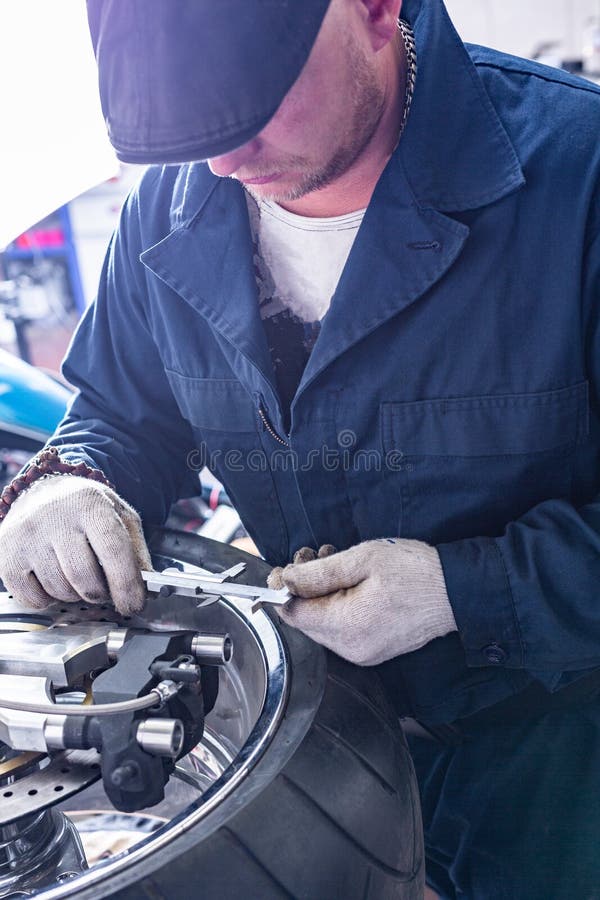 Man Repairing Motorcycle Tire with Repair Kit, Tire Plug Repair Kit for