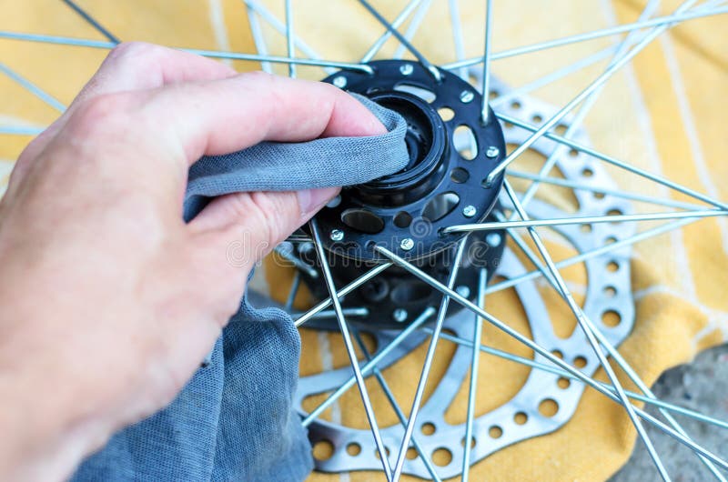 A Man Repairs a Bicycle Wheel. Stock Image Image of fixing, tool