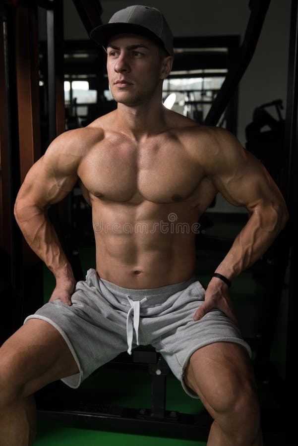 Man Rests In Gym After Having A Workout. Power, muscular.