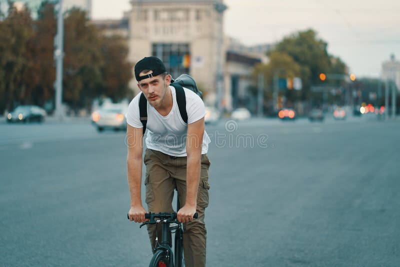 Man Riding Bicycle In Urban City Holding Hands On Handlebar Stock Image Image Of Attractive