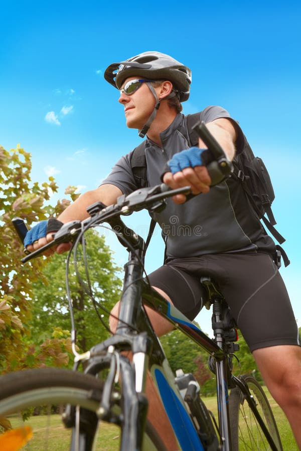 Man riding his bike stock photo. Image of leisure, health 81184