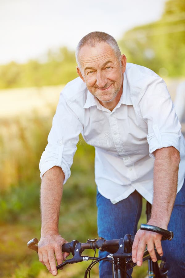 Man riding bike in summer royalty free stock photography Man riding bike in summer royalty free stock photography