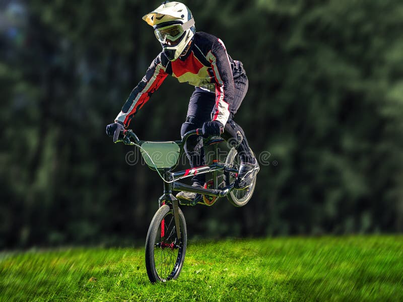 Man Riding Bmx Bike Performing a Trick Stock Image Image of active
