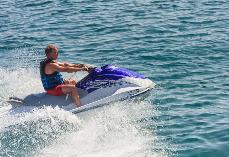 A man riding a jet ski editorial photography. Image of sports 50302552