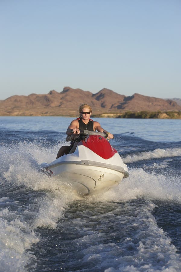 Man Riding Water Scooter on Lake Stock Image Image of recreational