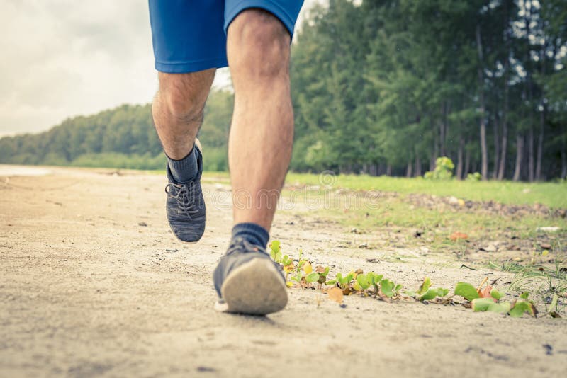 Man Runner Legs Running Close Up on Shoe, Men Jogging on the Beach
