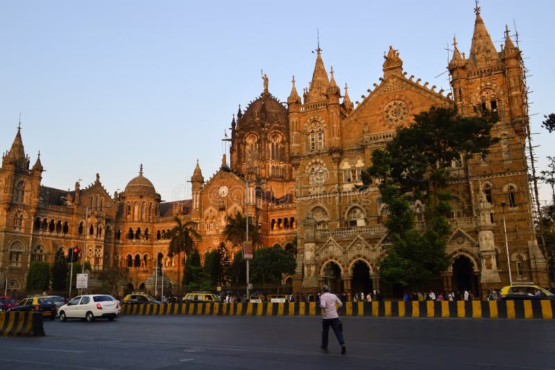 Man is running across a road near Chhatrapati Shivaji Terminus railway station Victoria Terminus stock photography Man is running across a road near Chhatrapati Shivaji Terminus railway station Victoria Terminus stock photography