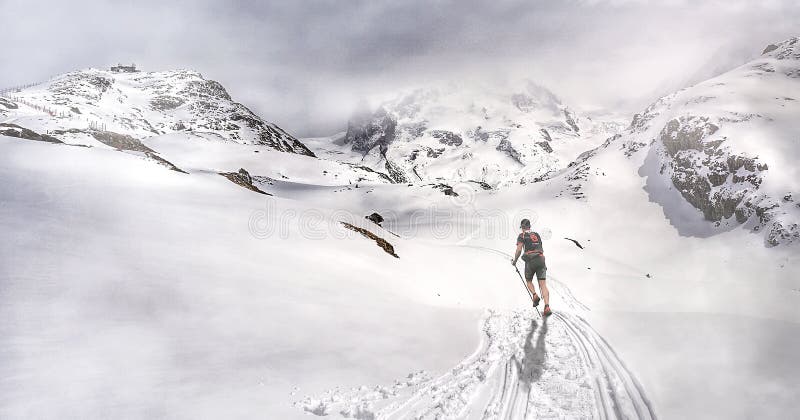 Man running through the mountains ascending towards the refuge stock images Man running through the mountains ascending towards the refuge stock images