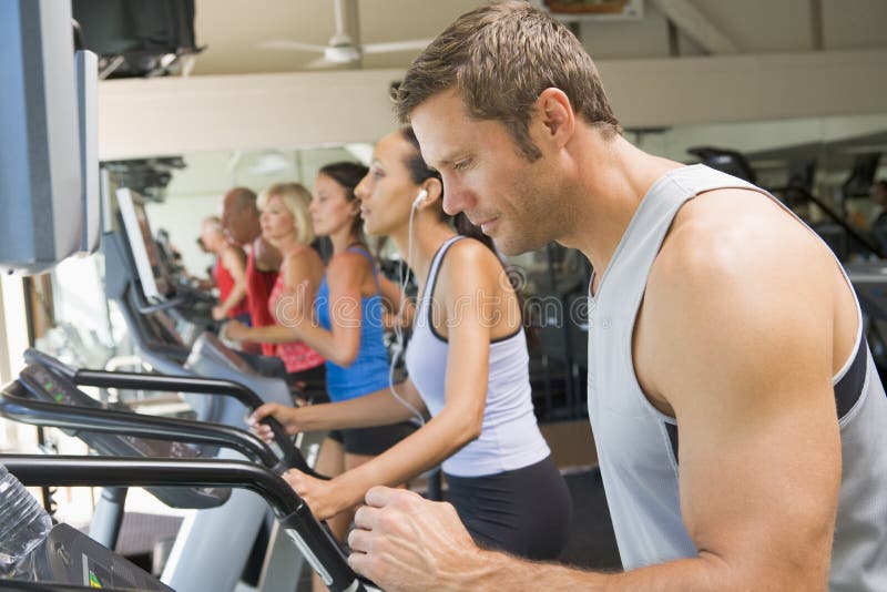 Man Running on Treadmill at Gym Stock Photo Image of running, side