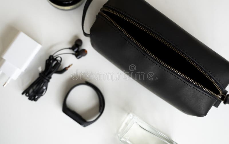 Man&x27;s black leather personal cosmetic bag or pouch for toiletry accessory. Style, retro, fashion, vintage and