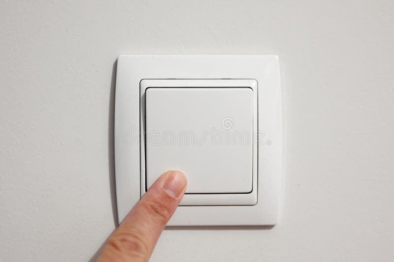 A man`s finger turning a wall switch on or off royalty free stock photos