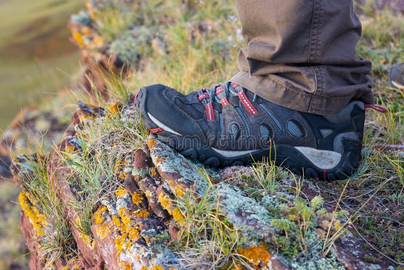 Man`s Foot in a Sneaker on a Rock Stock Image - Image of leisure ...