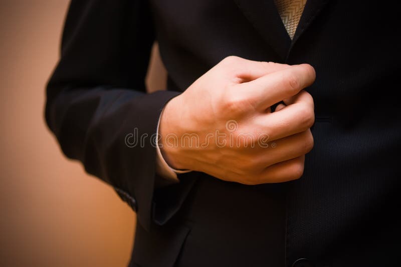 Man s hand holding jacket stock photo. Image of gray - 17010930