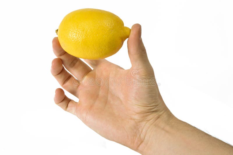 Man's hand holding a lemon stock image. Image of isolated - 26605045