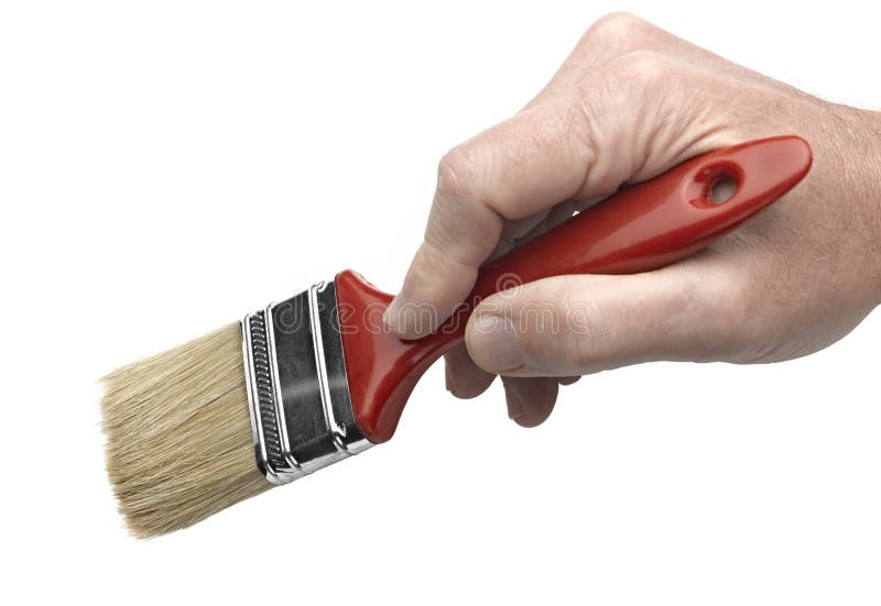 A man's hand holding a paintbrush royalty free stock image A man's hand holding a paintbrush royalty free stock image