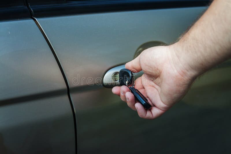 Man S Hand Opens the Car Door with a Key Stock Image Image of black