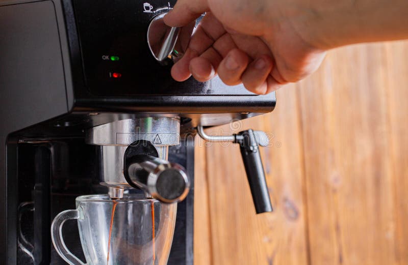 A Man& X27;s Hand Switches the Switch in the Coffee Maker To Make