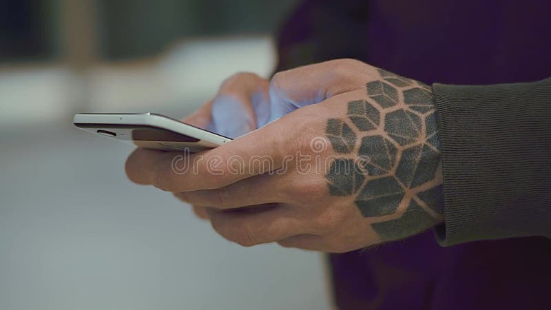 Man`s hands holding cell phone stock footage