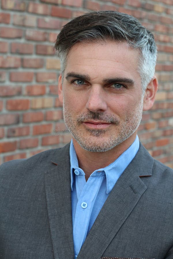 Man with Salt and Pepper Hair Close Up with Copy Space Stock Image