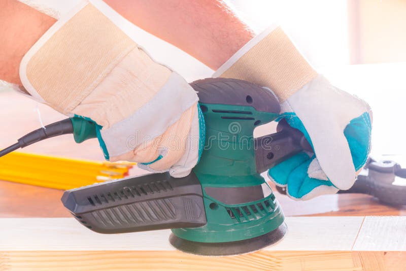 Man Sanding a Wood with Orbital Sander Stock Photo Image of