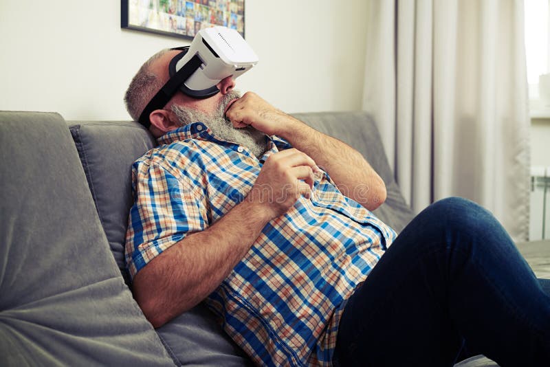 Man Scared To Death Using Virtual Reality Headset Glasses Stock Image