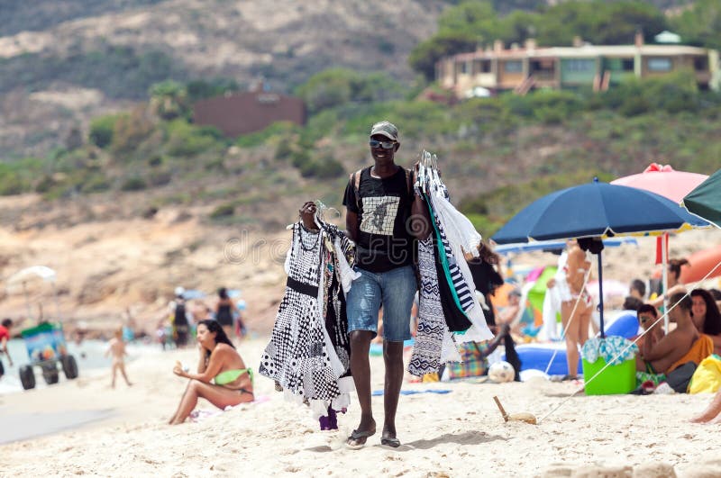 Man selling clothes in the beach