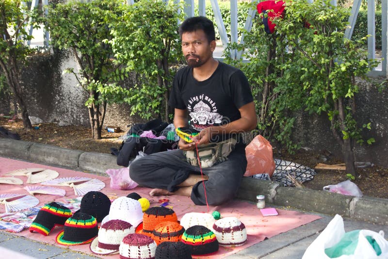 Man selling crochet editorial stock image. Image of green 21819059
