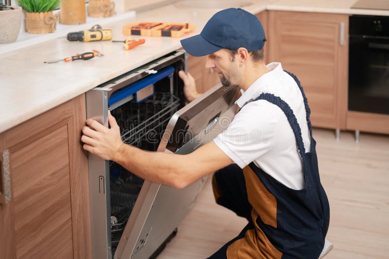 339 Man Repairing Dishwasher Stock Photos Free & RoyaltyFree Stock