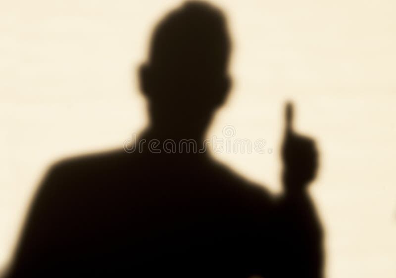 Man in shadow, thumb up
