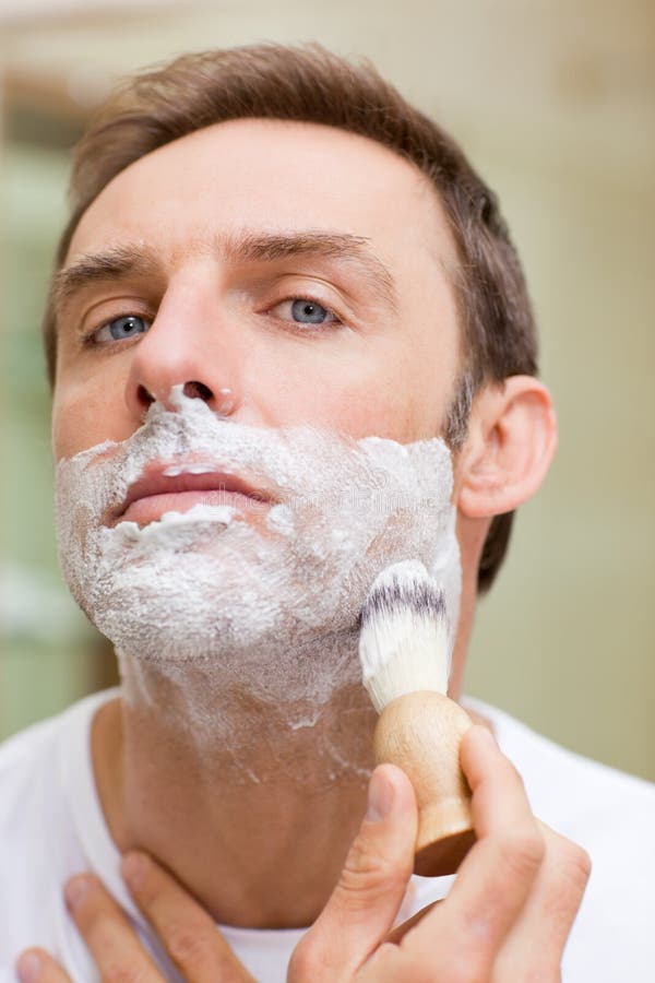 man-shaving-bathroom-18440353.jpg