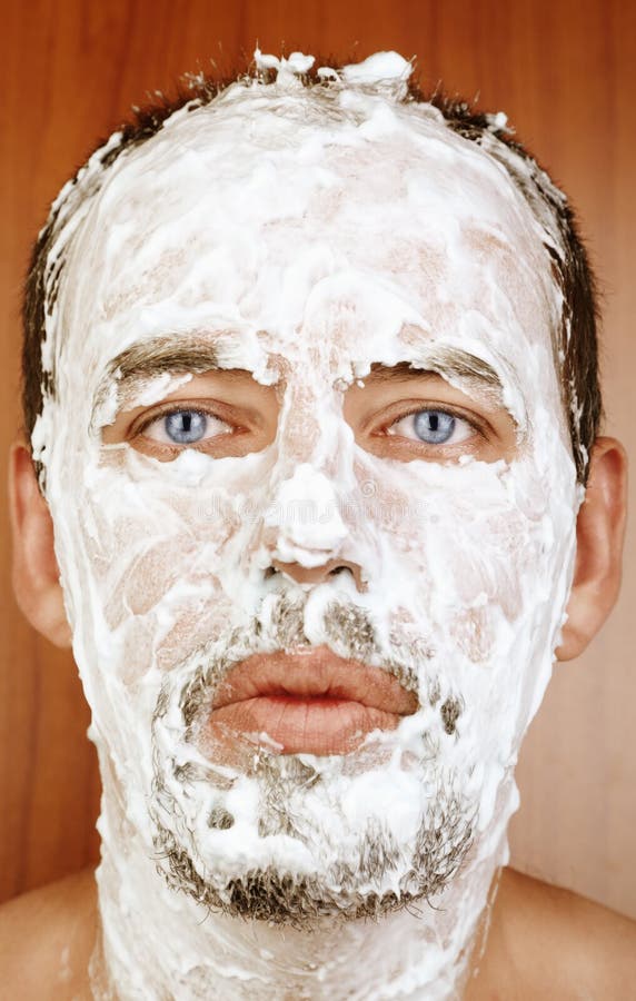 Man with shaving Cream on Face. 