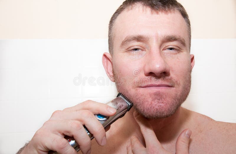 A Man Shaving His Face Stock Photos Image 23635213