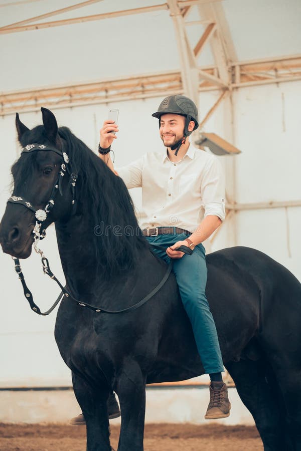 Man in a Shirt Riding on a Brown Horse Stock Image Image of
