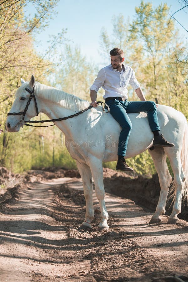 Man in a Shirt Riding on a Brown Horse Stock Image Image of fashion